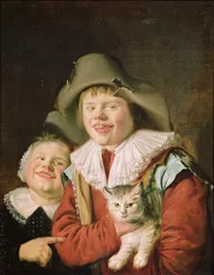Kinder spielen mit einer Katze